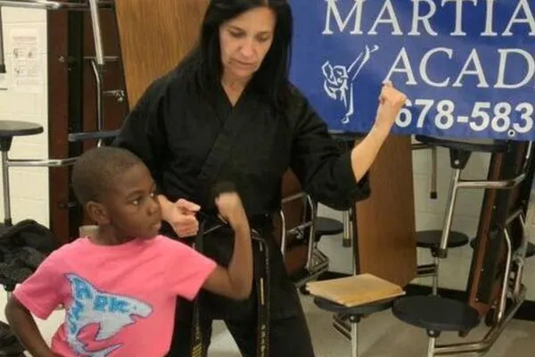 6-1 teen kicking in martial arts class